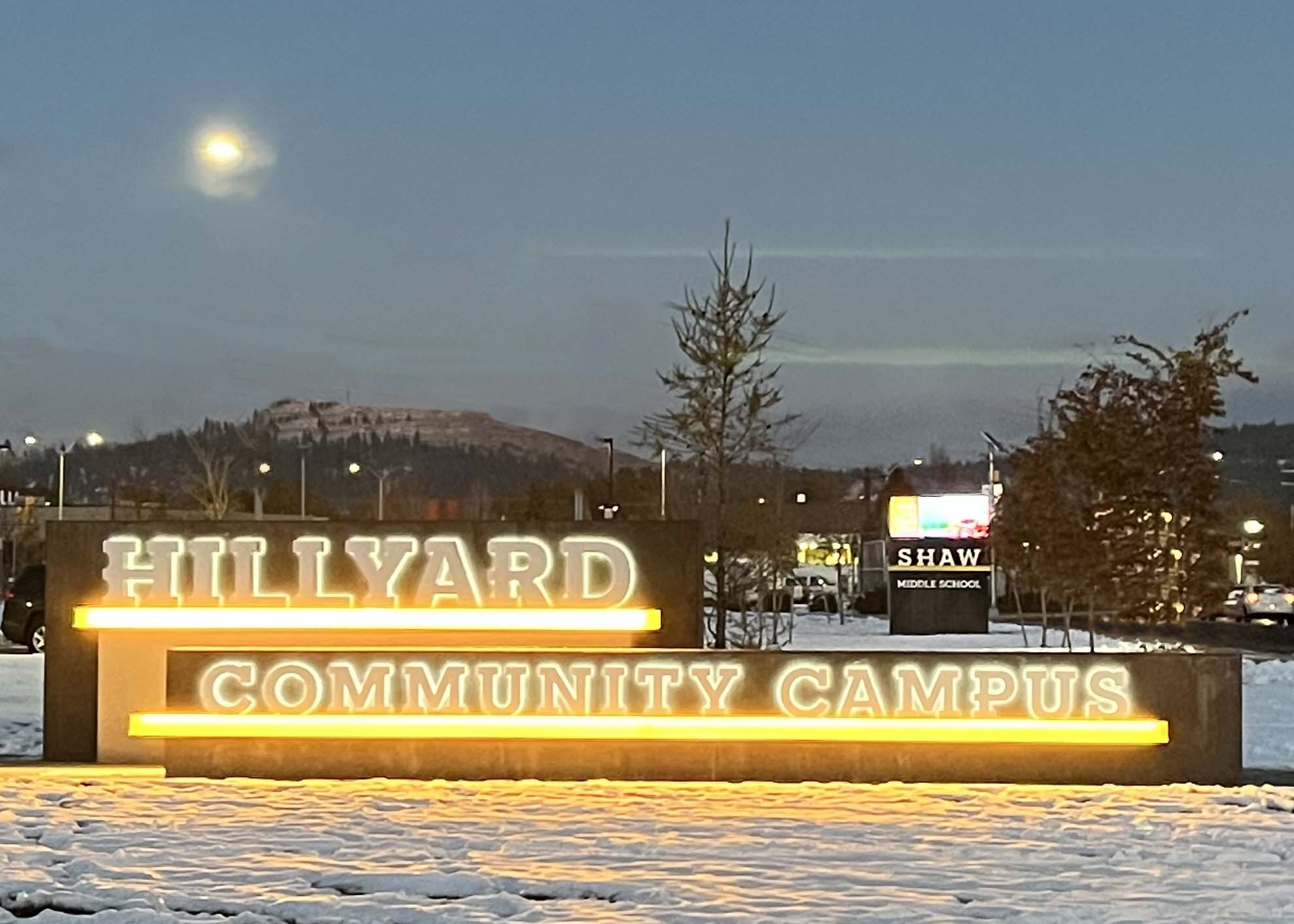 Hillyard Community Campus Sign lit up at night in the snow | Northeast Community Center
